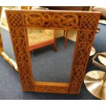 A carved wooden framed mirror 31.5in high x 23.5in