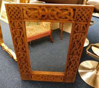 A carved wooden framed mirror 31.5in high x 23.5in