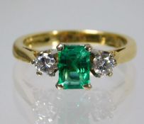 An 18ct gold ring set with approx. 0.5ct of diamond & emerald 3.7g size J
