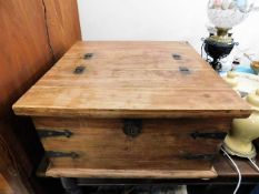 A 20thC. coffee table trunk 31in square x 16.5in h