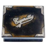 A vintage cigarette box with hallmarked silver fit