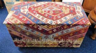 An upholstered blanket box