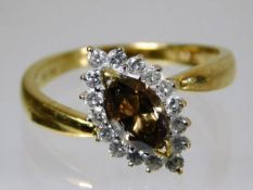 An 18ct gold ring with cinnamon centre diamond of