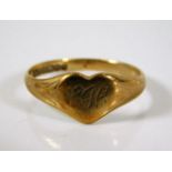 A 9ct gold heart shaped ring with rubbed initials