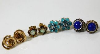 A 9ct gold pair of earrings set with opal with thr