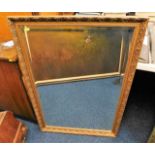 A decorative gilt framed mirror 39.5in high x 27.5
