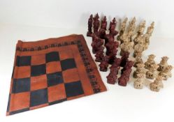 A Chinese chess set with Oriental styled pieces wi