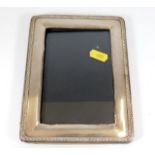 A silver photo frame 7in x 5.5in