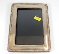 A silver photo frame 7in x 5.5in