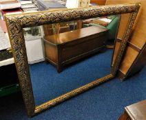 A gilt framed mirror with decorative frame 53in wi