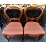 A pair of upholstered 19thC. mahogany balloon back