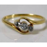 An 18ct gold ring set with three diamonds 3.1g siz