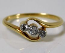 An 18ct gold ring set with three diamonds 3.1g siz