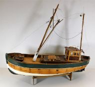 A wooden model of fishing boat 28in long. Provenan