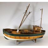 A wooden model of fishing boat 28in long. Provenan