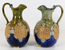 A matched pair of Royal Doulton jugs, one with fai