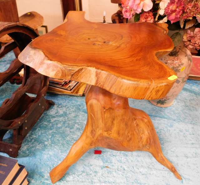 A carved wood table in naturalistic form. Provenan