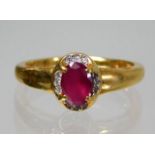 An 18ct gold ring set with ruby & diamond 3.7g siz