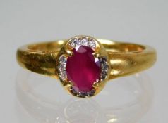 An 18ct gold ring set with ruby & diamond 3.7g siz