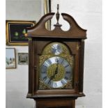 A modern grand mother clock with brass & silver co