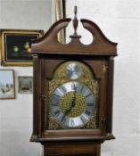 A modern grand mother clock with brass & silver co