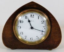 A French oak cased mantle clock