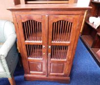 A late 20thC. stained cabinet 39.25in high x 25.75