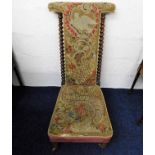 A 19thC. upholstered prie dieu chair with barley t
