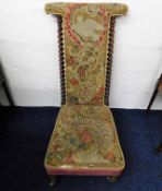 A 19thC. upholstered prie dieu chair with barley t