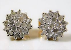 A pair of 9ct gold cluster earrings, set with 0.5c