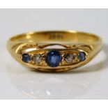 An antique 18ct gold ring set with diamond & sapph