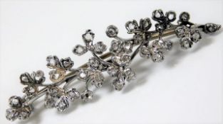 A 9ct white gold organic style brooch set with dia