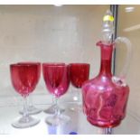 A Victorian cranberry glass decanter twinned with