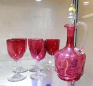 A Victorian cranberry glass decanter twinned with