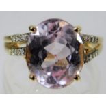 A 14ct gold ring set with kunzite & diamond 4.8g s