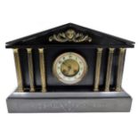 A slate mantel clock with brass decor & pillars wi