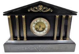 A slate mantel clock with brass decor & pillars wi