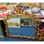 A decorative ornate gilt framed mirror 48in wide x