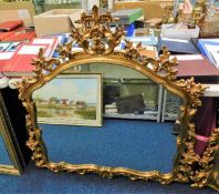 A decorative ornate gilt framed mirror 48in wide x