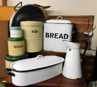 A large colander, an enamel bread bin, a meat chop