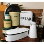 A large colander, an enamel bread bin, a meat chop