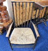 An Ernest Gimson style low level rush seated chair