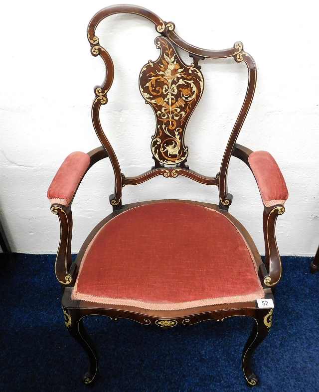 An upholstered Regency period arm chair inlaid thr