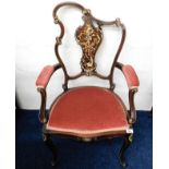 An upholstered Regency period arm chair inlaid thr