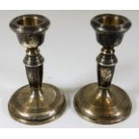 A pair of silver candle holders 4.25in tall