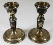 A pair of silver candle holders 4.25in tall