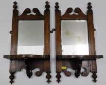 A pair of Edwardian mahogany mirrored wall sconces