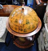 A 20thC. drinks bar globe with hardwood frame & 17