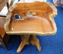 A very heavy hand carved tree chair. Provenance -