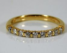 An 18ct gold half eternity ring set with 0.36ct di